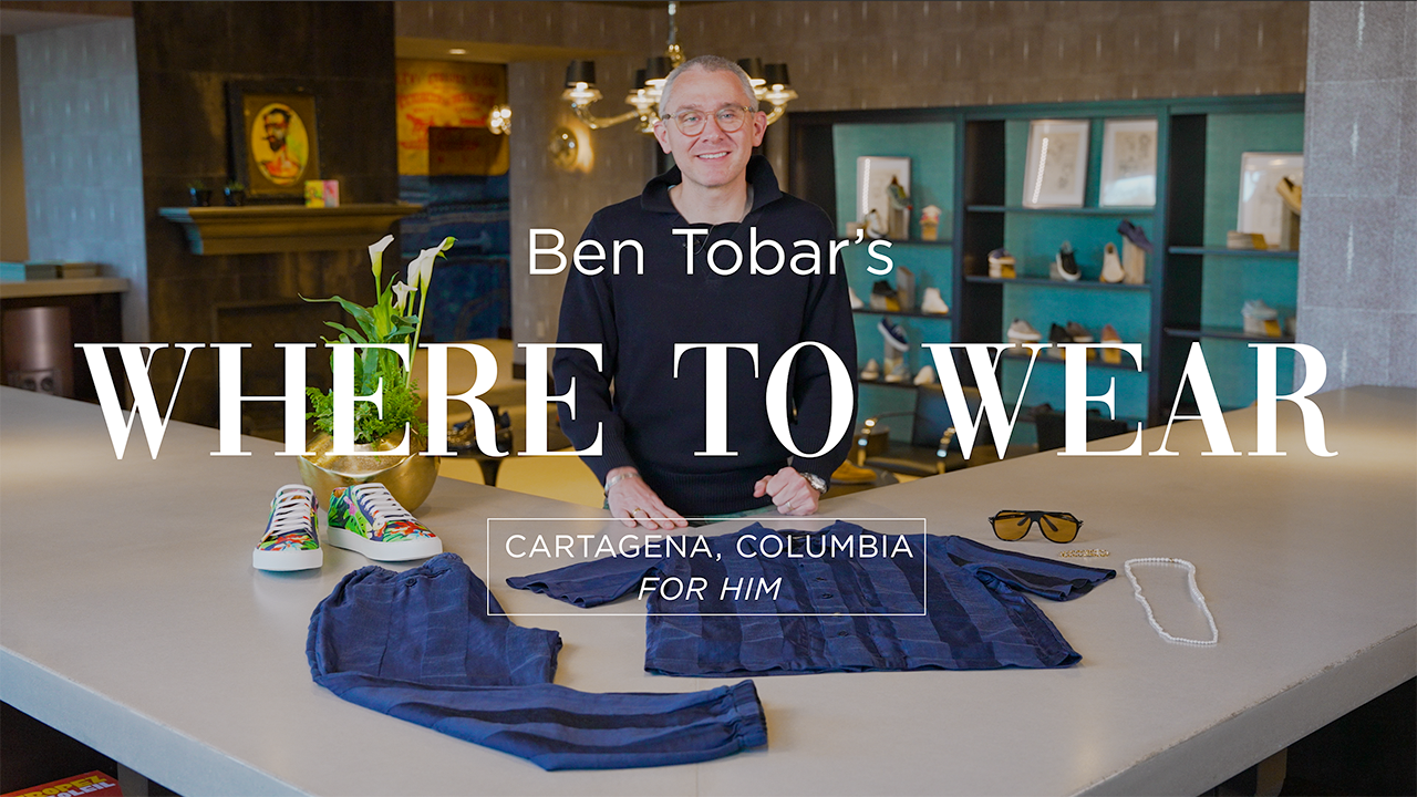 image with text "Ben Tobar's Where to Wear Cartagena, Columbia For Him" image is of personal shopper Ben Tobar showcasing blue striped silk set from Barena Venezia