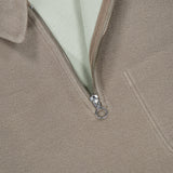 Tan 04651/ A TRIP IN A BAG CW Quarter Zip Polo Pullover with a light green interior collar, perfect as casual travel clothing.