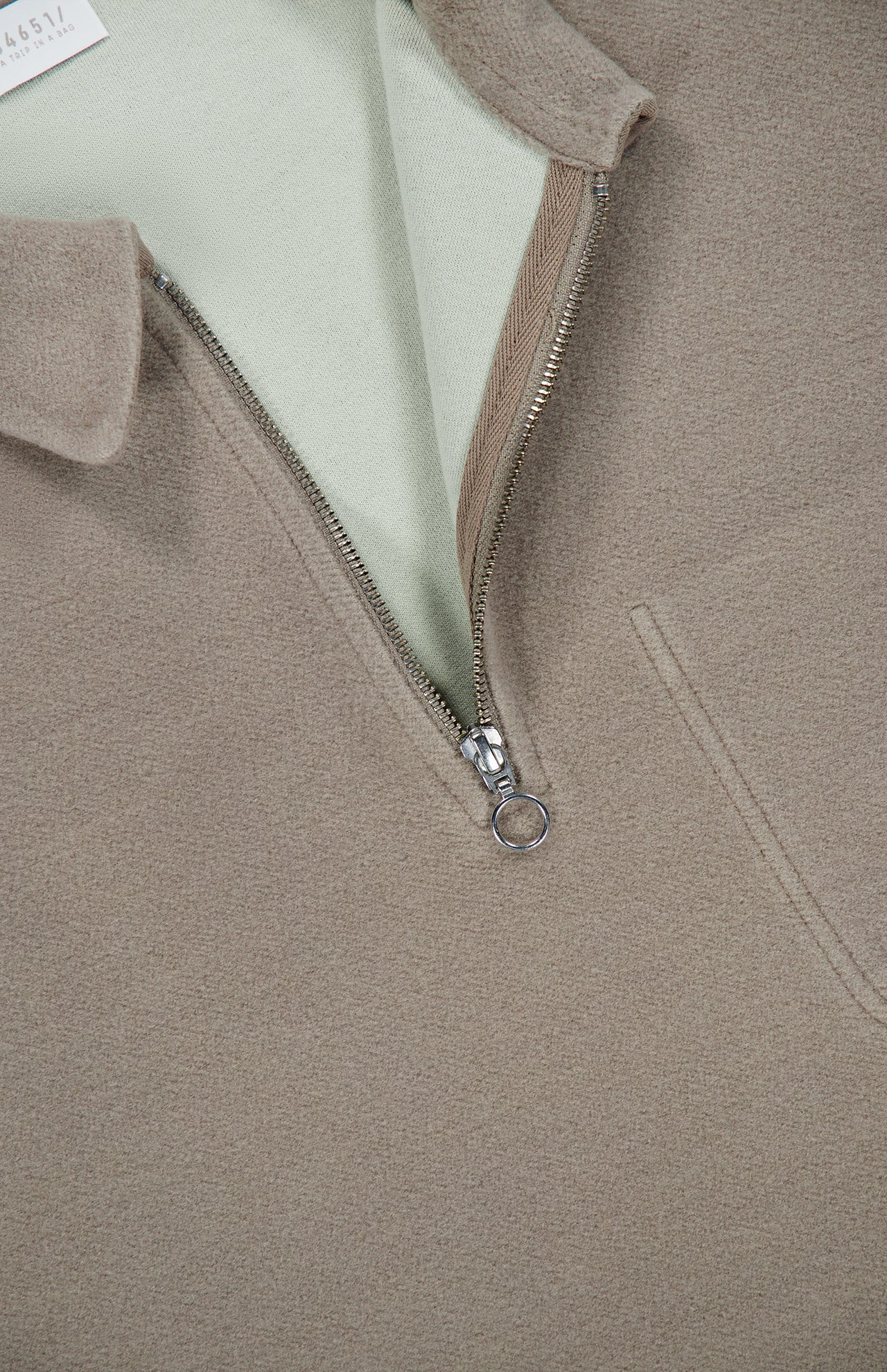 Tan 04651/ A TRIP IN A BAG CW Quarter Zip Polo Pullover with a light green interior collar, perfect as casual travel clothing.