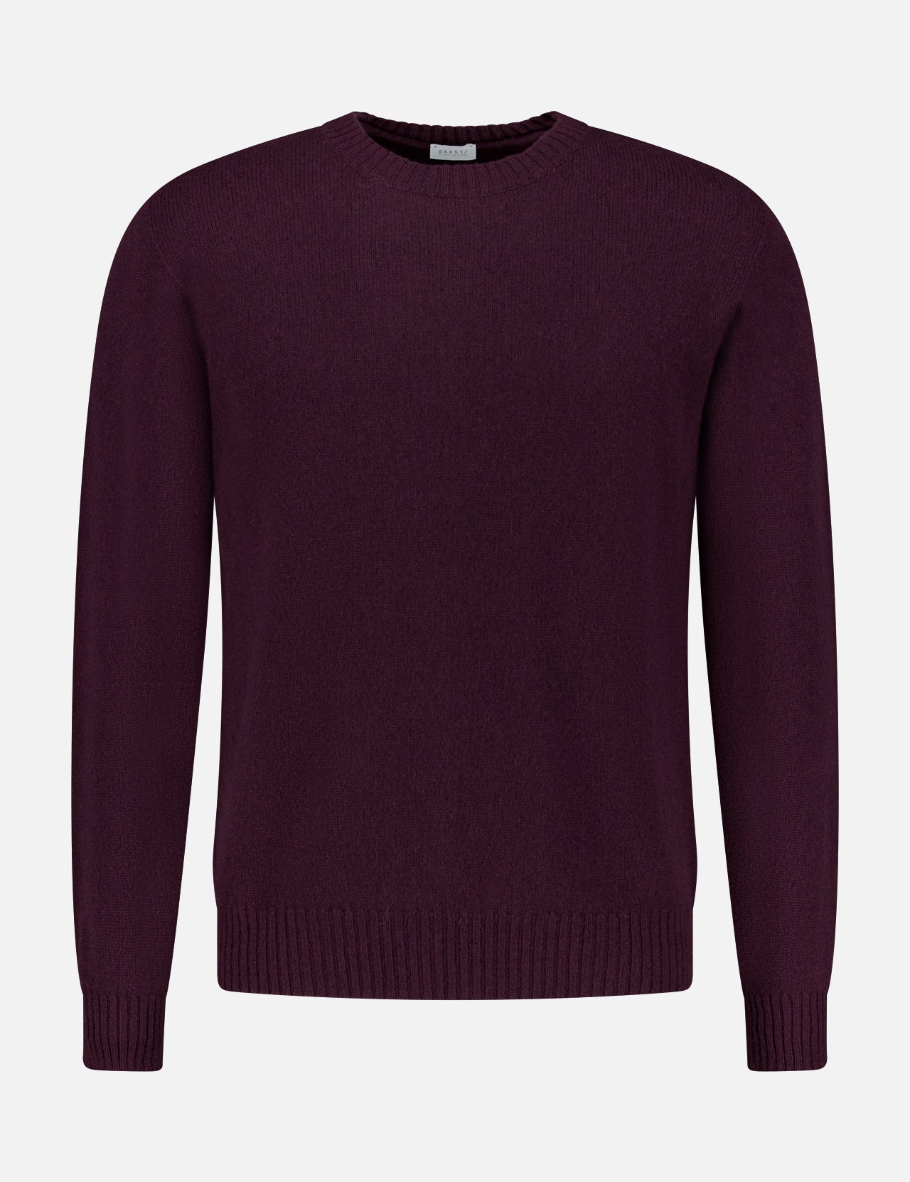 The 04651/ A TRIP IN A BAG Extreme Cashmere Crewneck Sweater, featuring a plain, long-sleeved design in dark purple, is displayed against a white background.