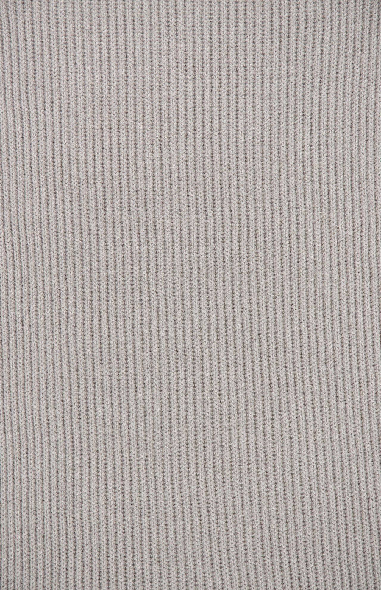 Close-up of a light gray, taupe-toned ribbed knit Extreme Cashmere Scarf by 04651/ A TRIP IN A BAG.