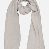 Beige ribbed knit Extreme Cashmere Scarf by 04651/ A TRIP IN A BAG draped in a loop.