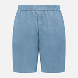 The Linen Bermuda Short by 04651/ A TRIP IN A BAG features light blue linen, an elastic waistband, and a front seam. Expertly crafted in Portugal, it’s shown against a plain white background.