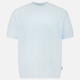 The TP T-shirt by 04651/ A TRIP IN A BAG is a pure cotton, light blue short-sleeve crew neck tee shown on a white background—perfect for classic, everyday comfort.