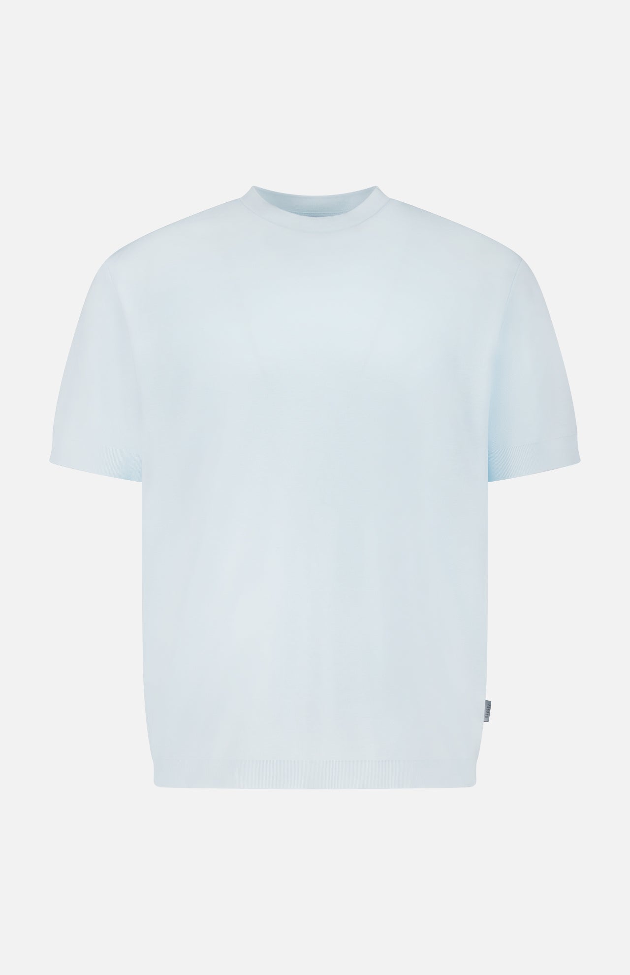 The TP T-shirt by 04651/ A TRIP IN A BAG is a pure cotton, light blue short-sleeve crew neck tee shown on a white background—perfect for classic, everyday comfort.