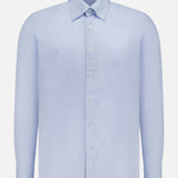 The 100 HANDS Oxford Casual Fit Shirt is a light blue men’s cotton shirt featuring long sleeves, a button-up front with white buttons, and a collar. Made in India, it is displayed against a plain white background.