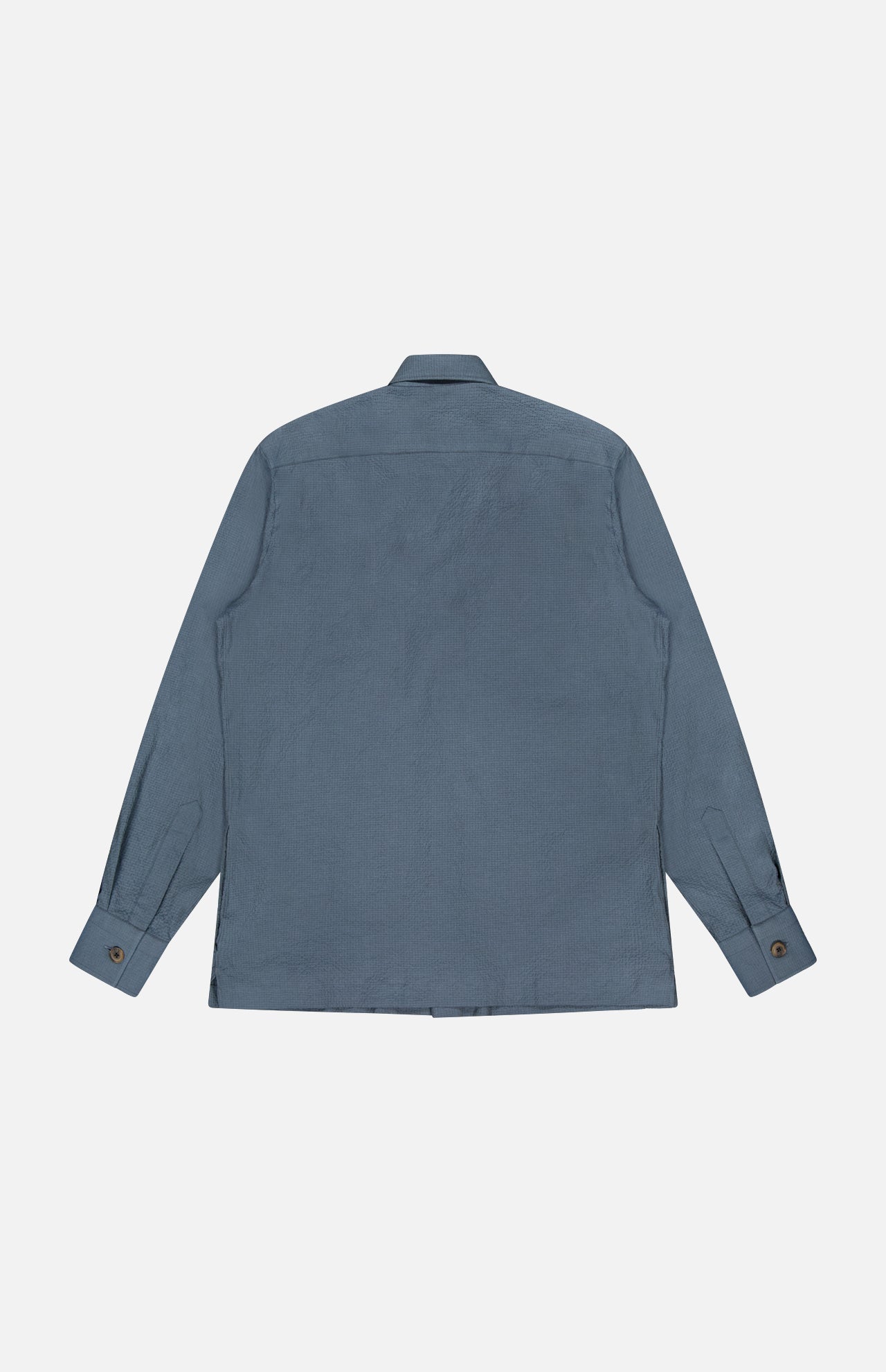 The 100 HANDS Seersucker Dress Shirt, shown from the back in blue with long sleeves, a collar, buttoned cuffs, and a straight hem, is displayed against a plain white background.