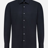 A plain black silk casual fit dress shirt by 100 HANDS, featuring a classic collar and white buttons, displayed on a white background in the brand’s signature timeless style.