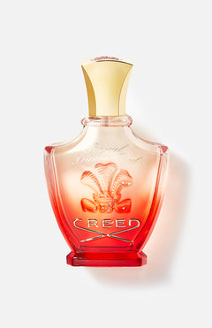 A luxurious bottle of CREED Royal Princess Oud perfume featuring a gold cap, a red-to-clear gradient glass design, and the iconic Creed logo—an elegant fragrance for discerning tastes.