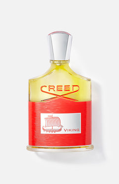 Viking 100 ml Fragrance by CREED features a silver cap, yellow liquid, and a red label with a Viking ship—an assertive men’s scent for the modern man.