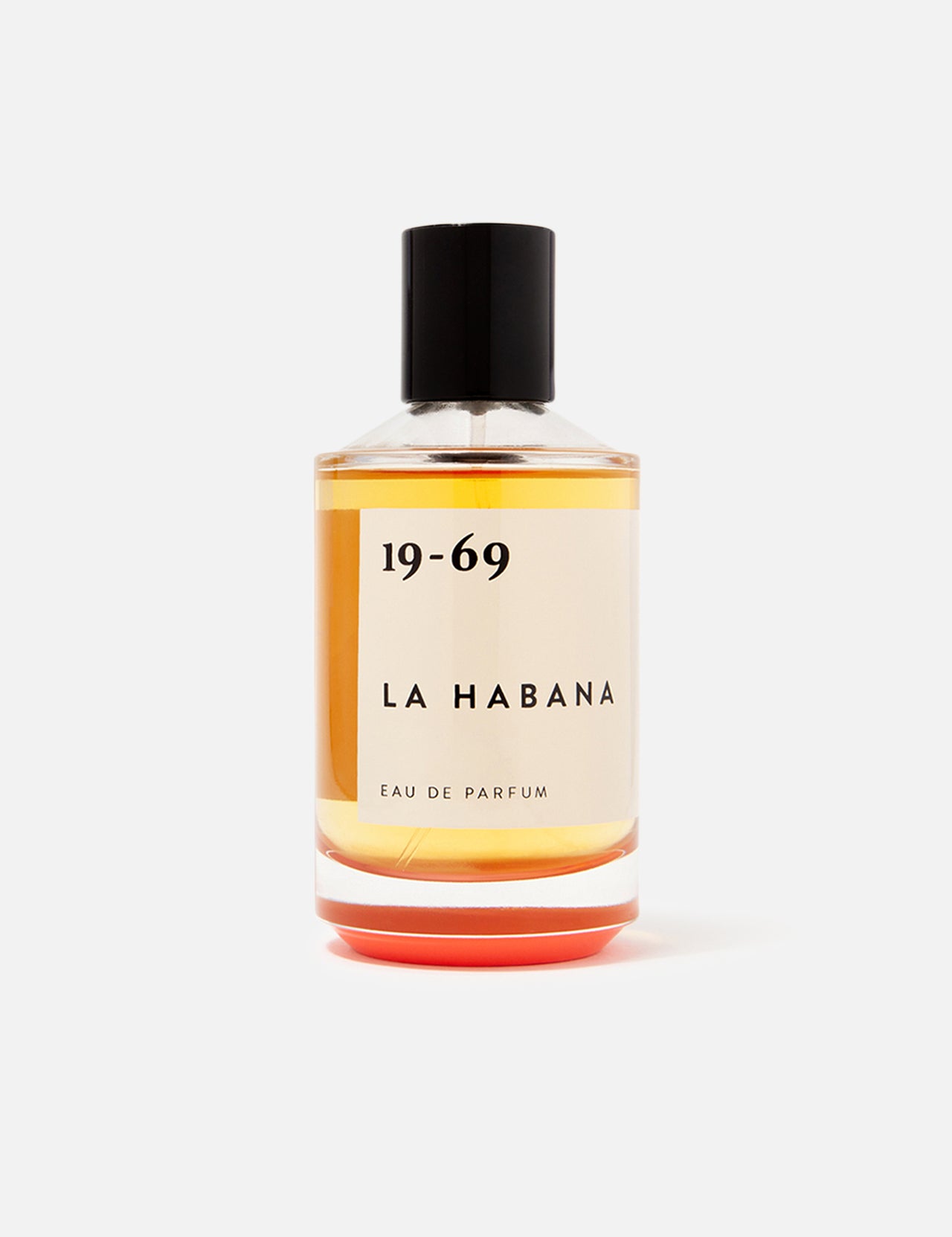 A clear glass bottle of 19-69 La Habana EDP 100 ml Fragrance features amber liquid, a black cap, and minimalist black text—a unisex scent inspired by Havana.