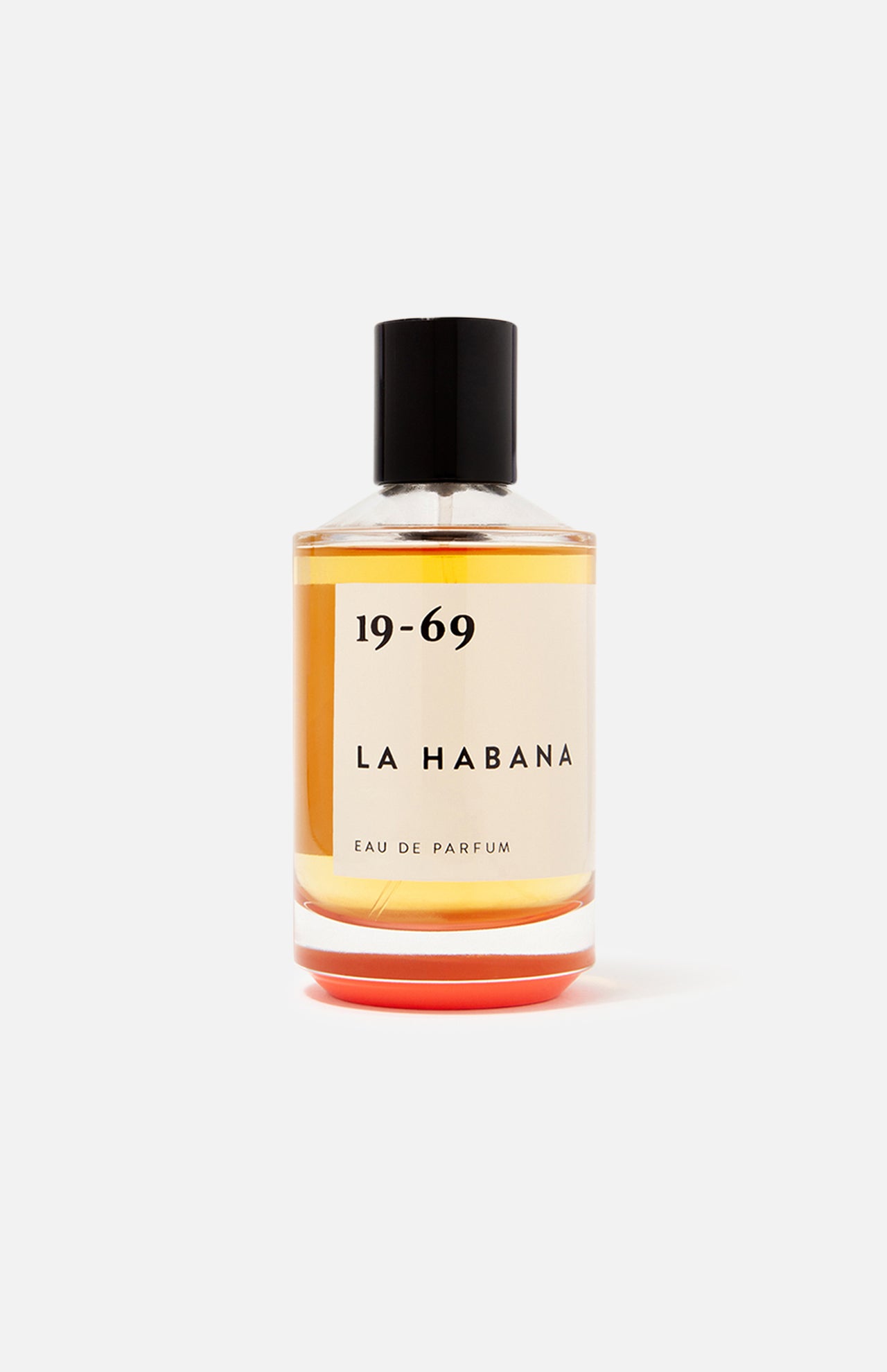 A clear glass bottle of 19-69 La Habana EDP 100 ml Fragrance features amber liquid, a black cap, and minimalist black text—a unisex scent inspired by Havana.
