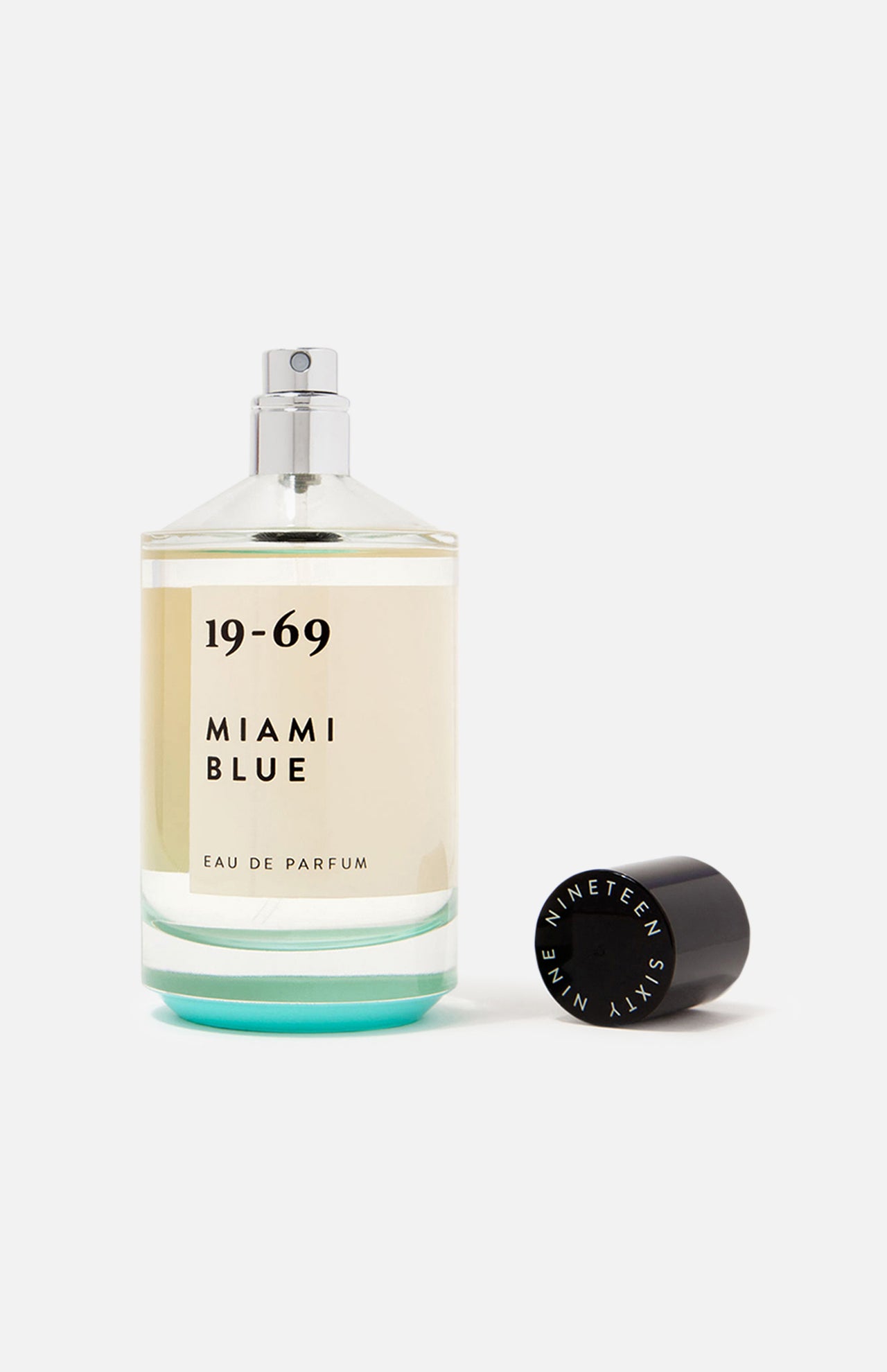 A clear glass bottle of 19-69 Miami Blu EDP 100 ml Fragrance, a fresh aquatic unisex scent, with a black "Nineteen Sixty Nine" cap beside it, set against a white background.