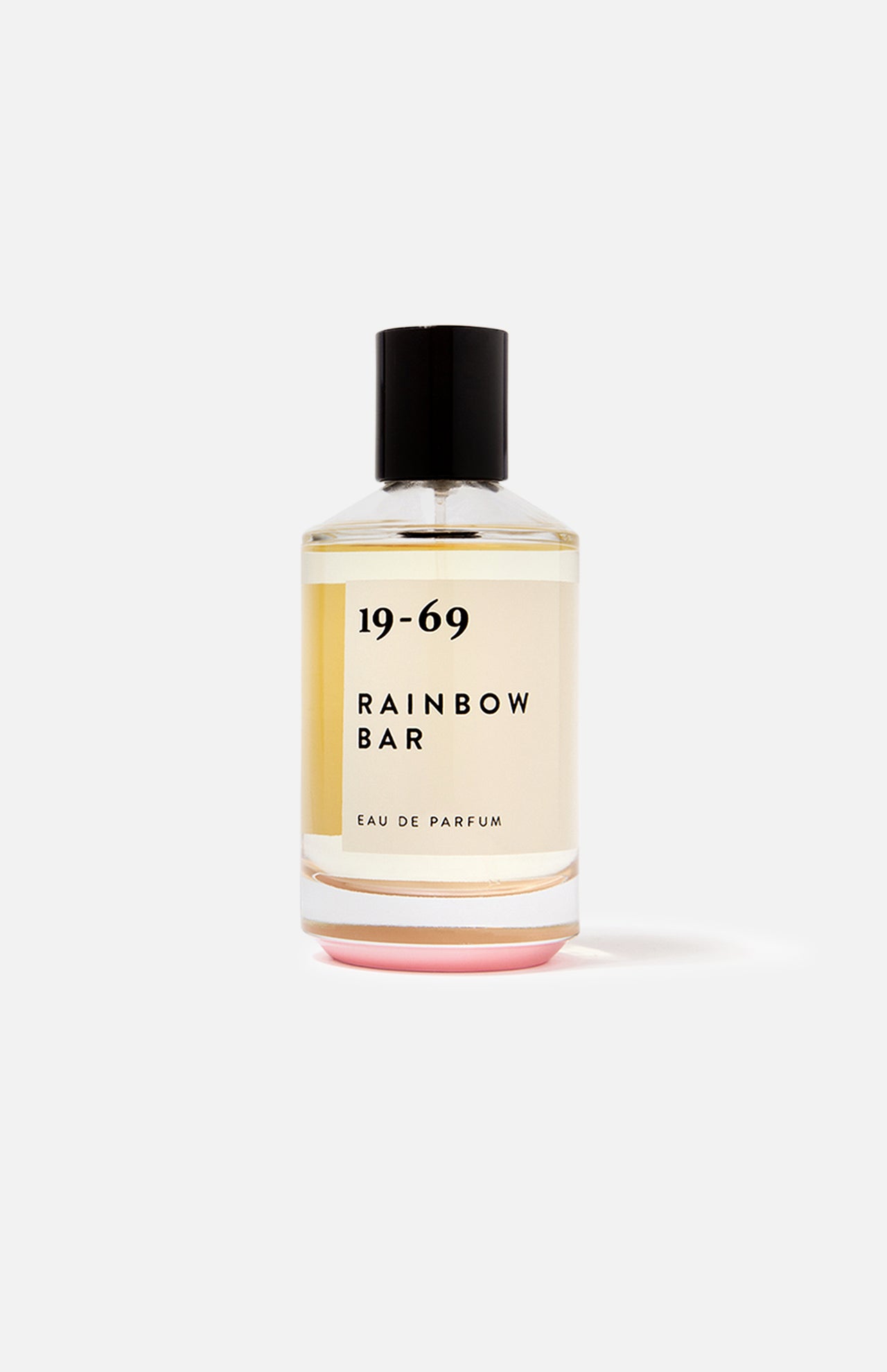 A 100 ml bottle of 19-69 Rainbow Bar EDP Fragrance, a unisex scent inspired by '80s glam rock, in clear glass with a black cap and cream label, displayed on a plain white background.