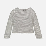 The TWP Hand Crochet Slash Neck Top is a long-sleeved, silver mesh sweater with a diamond pattern and boxy fit, shown on a white background.