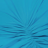 Close-up of the Enid Ruched Detail Maxi Dress by RONNY KOBO, featuring bright turquoise fabric with gathered, radiating ruching for a chic, textured look—ideal detail for a stylish wedding guest dress.