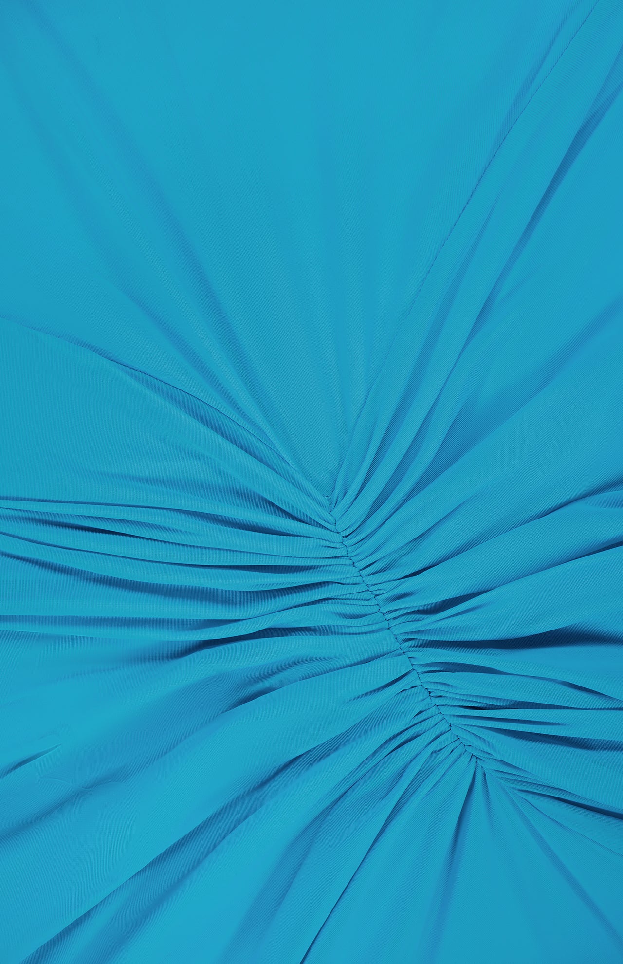 Close-up of the Enid Ruched Detail Maxi Dress by RONNY KOBO, featuring bright turquoise fabric with gathered, radiating ruching for a chic, textured look—ideal detail for a stylish wedding guest dress.