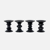 Four HERMAN MILLER Eames Turned Stools, Shape A—black, uniquely contoured cylinders inspired by the iconic Eames walnut stool—are evenly spaced in a row against a plain white background.
