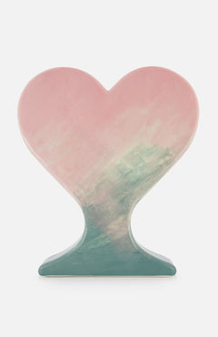The Paisajes / Spring by Rosa Cortiella for TOT COR is a heart-shaped ceramic vase with a pink and green gradient, standing upright on a flat base against a plain white background.