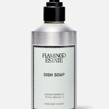 A 12 fl oz (355 ml) silver pump bottle of FLAMINGO ESTATE Heirloom Tomato Dish Soap, featuring a fresh tomato leaf scent and biodegradable cleansers, set against a plain light gray background.