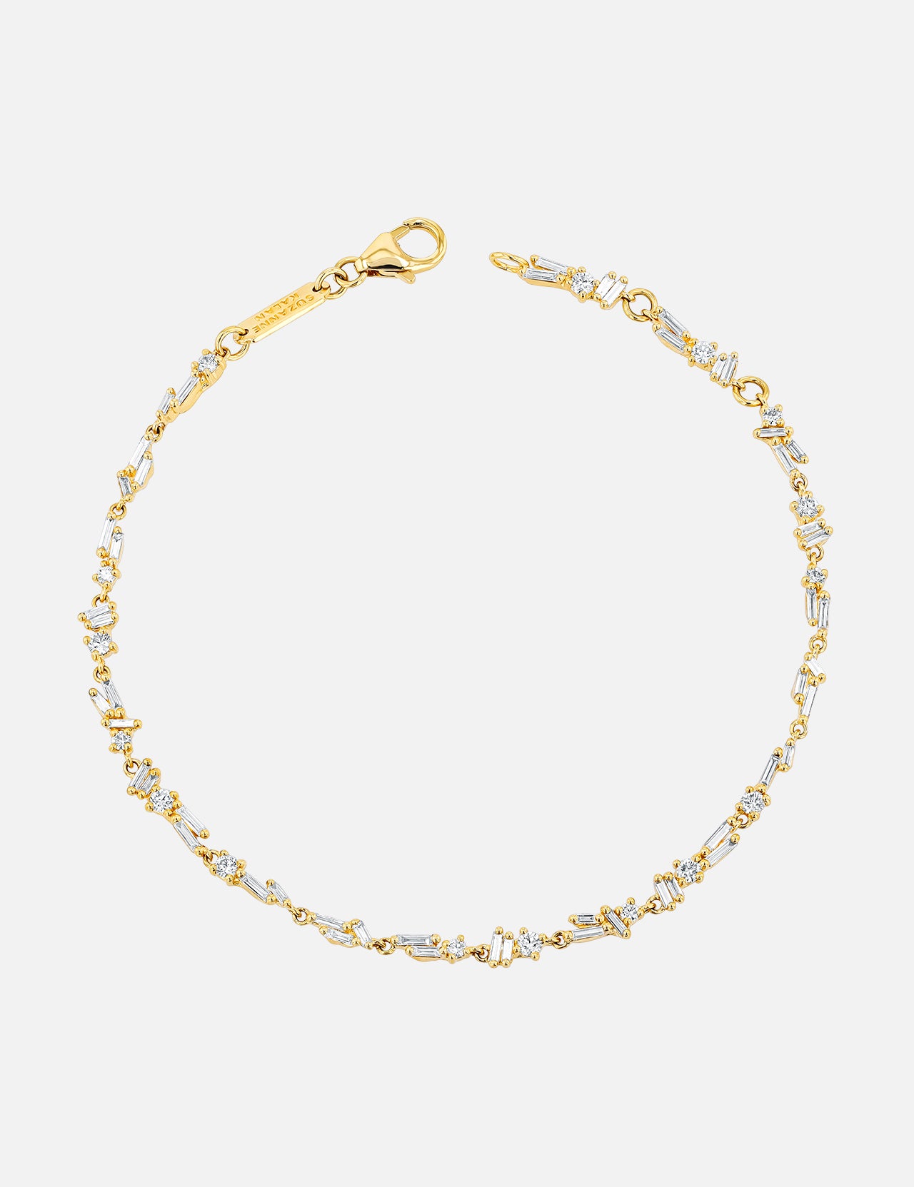 The SUZANNE KALAN Classic Diamond Chain Tennis Bracelet is crafted in 18K gold, featuring sparkling diamonds set along a fine linked chain with a lobster clasp, shown on a plain white background.