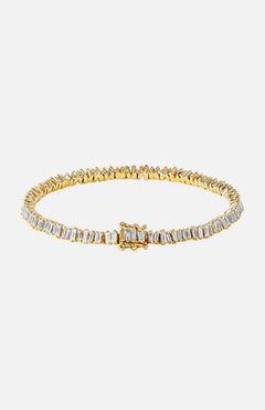 The SUZANNE KALAN Classic Baguette Tennis Bracelet in yellow gold features a continuous row of baguette diamonds with an even setting and secure clasp, displayed elegantly on a white background.