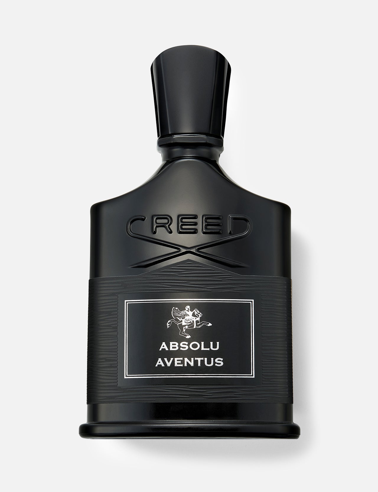 A black bottle of CREED Absolu Aventus 100 ml Fragrance with a silver label, displayed against a light gray background, embodies the essence of the iconic scent with its signature citrus notes.