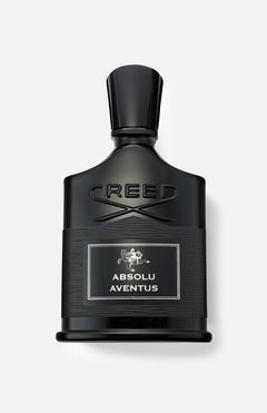 A black bottle of CREED Absolu Aventus 100 ml Fragrance with a silver label, displayed against a light gray background, embodies the essence of the iconic scent with its signature citrus notes.