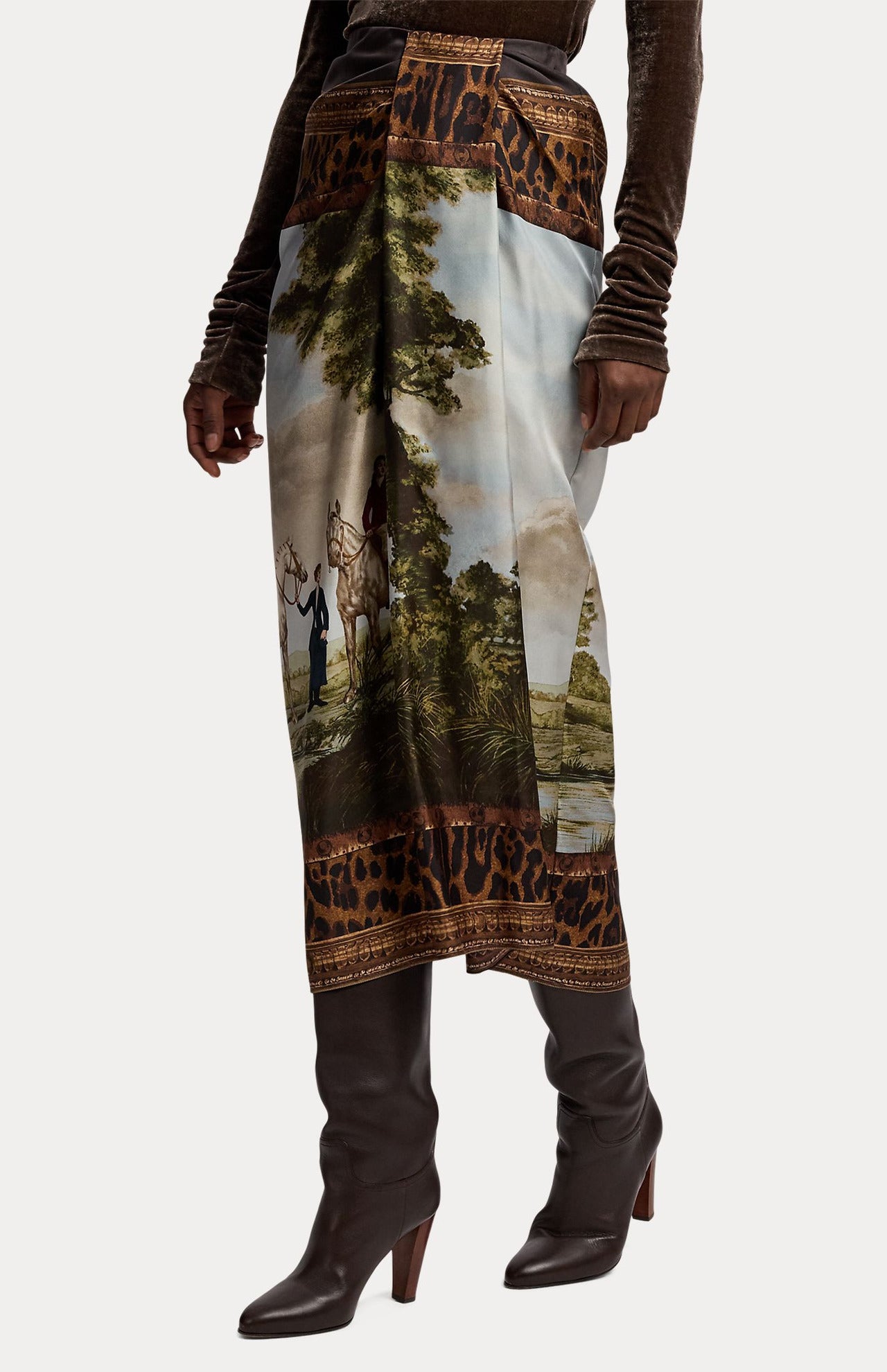 This RALPH LAUREN COLLECTION Scenic Silk Twill Pencil Skirt is made in Italy and features a pastoral landscape print of people and horses, bordered by leopard print trim at the waist and hem.