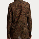 A person is seen from the back wearing the RALPH LAUREN COLLECTION Paisley Collared Long Sleeve Blouse. The blouse features a loose fit and showcases a dark brown paisley print with shades of gold and red, making it perfect for elevating any fall wardrobe. The individual stands against a plain background.