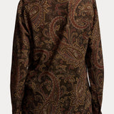 Back view of a person wearing a RALPH LAUREN COLLECTION Paisley Collared Long Sleeve Blouse in dark brown and tan paisley print.