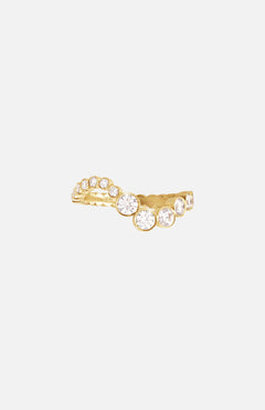 The Ensamble Ocean ring by SOPHIE BILLE BRAHE features a curved gold band adorned with a row of round, sparkling white gemstones—an elegant choice for bridal jewelry or as a sophisticated diamond wave ring.