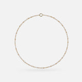 The Gravity Chain 20" Necklace by SPINELLI KILCOLLIN is a delicate gold piece with evenly spaced clear gemstones in a circular design, ideal for handmade jewelry enthusiasts.