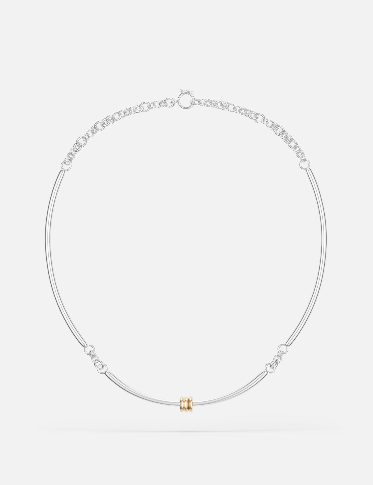The Hello Tria Silver Necklace by SPINELLI KILCOLLIN features a minimalist sterling silver chain with a central gold cylinder accent and subtle decorative links, reflecting refined modular jewelry design.