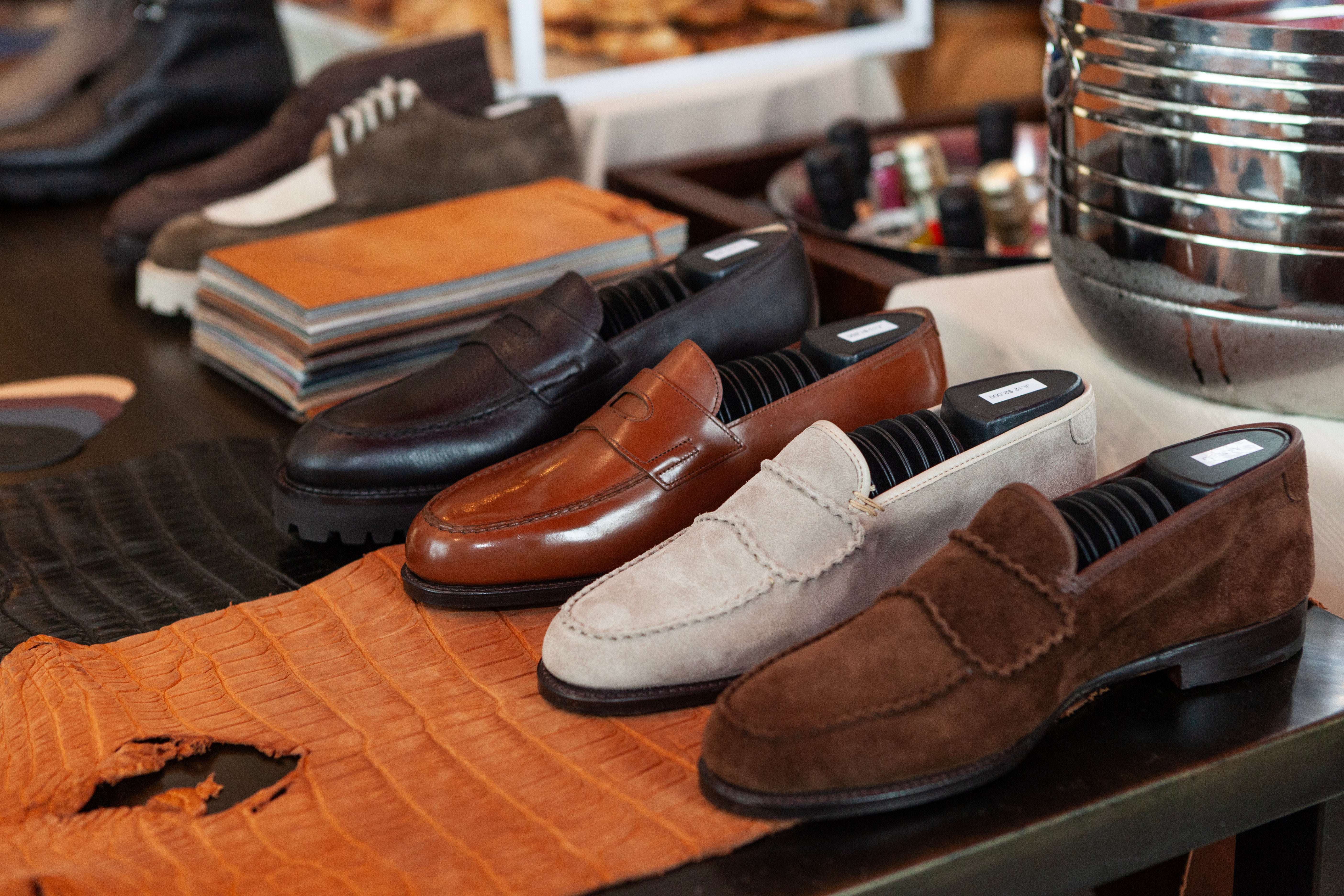 Row of loafers on a display table with a blurred background