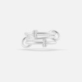 The Jovie Double Pave Ring by SPINELLI KILCOLLIN features three interlocking sterling silver bands with two groups of pavé-set clear gemstones, shown on a white background for a modern modular look.