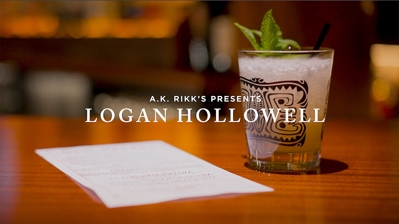 image with text "A.K. Rikk's Presents Logan Hollowell" image is of a tiki bar counter with a drink and menu