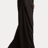 RALPH LAUREN COLLECTION Mini Herringbone Standard Pants in a high-waisted, wide-leg dark grey herringbone wool flannel, worn with dark brown leather heeled boots.