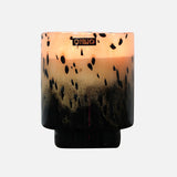 The ONNO Art Brigitte M Zanzibar Candle holder features a round, designer gradient design fading from light peach to black with black speckles and a metallic logo near the rim—ideal for displaying your luxury scented candle.