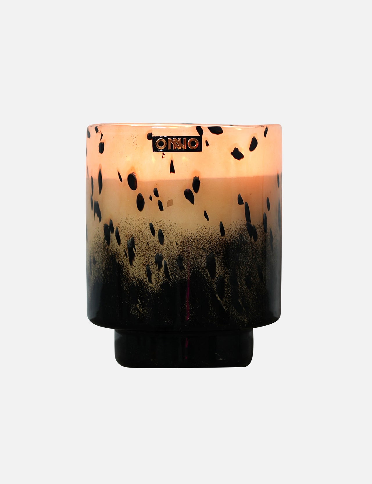 The ONNO Art Brigitte M Zanzibar Candle holder features a round, designer gradient design fading from light peach to black with black speckles and a metallic logo near the rim—ideal for displaying your luxury scented candle.