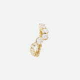 The Ensamble Ocean ring by SOPHIE BILLE BRAHE features a row of round, bezel-set white gemstones that taper in size along the gold band—an elegant choice for modern bridal jewelry, showcased on a minimal background.