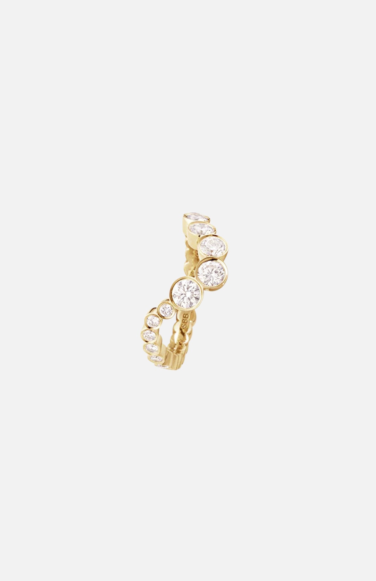 The Ensamble Ocean ring by SOPHIE BILLE BRAHE features a row of round, bezel-set white gemstones that taper in size along the gold band—an elegant choice for modern bridal jewelry, showcased on a minimal background.