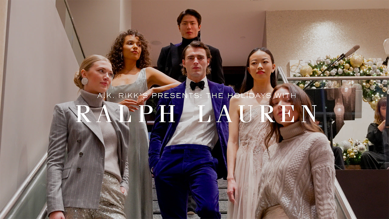 image with text "A.K. Rikk's Presents The Holidays with Ralph Lauren" image is of models wearing Ralph Lauren black tie attire posing on a staircase
