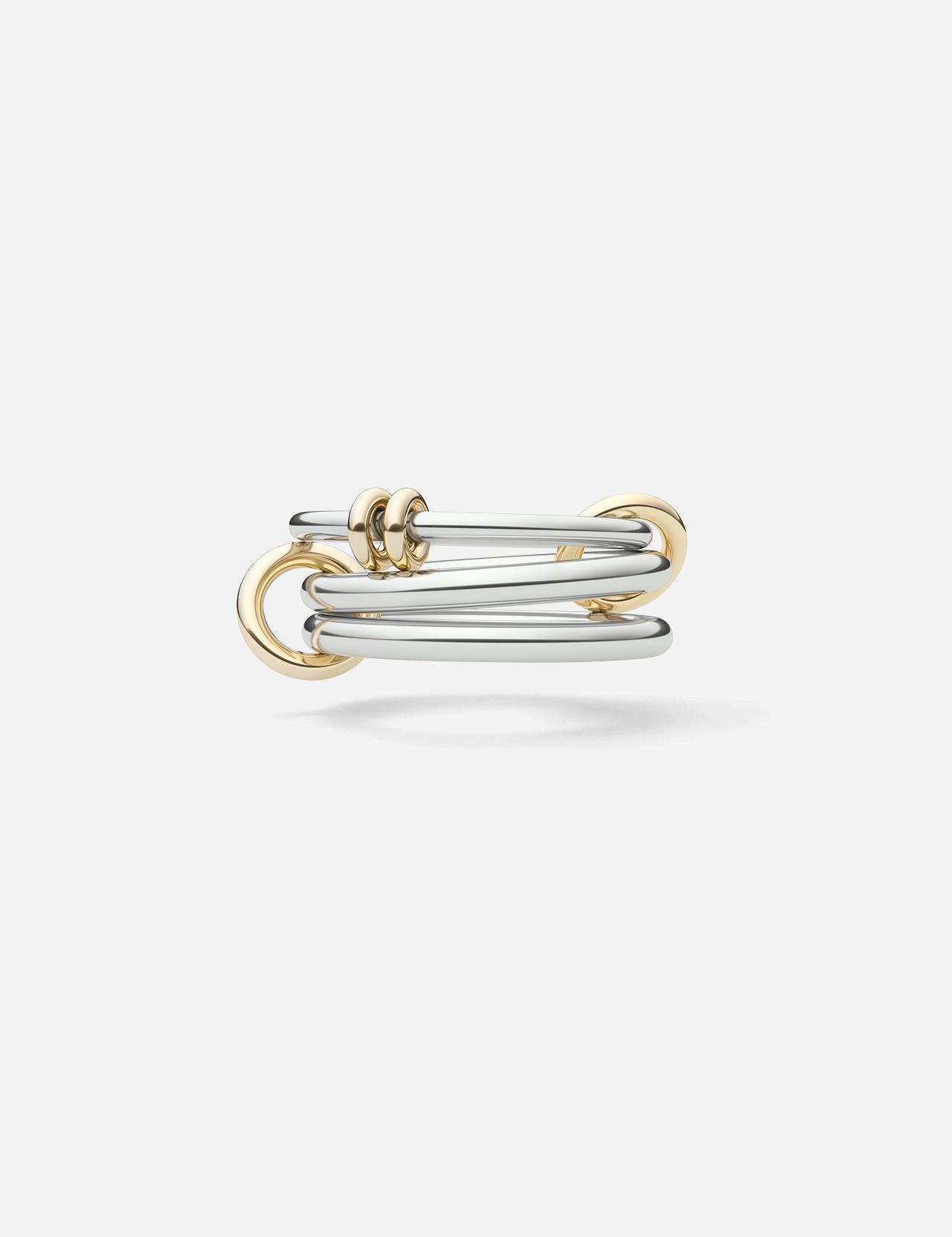The Raneth 3 Band Ring by SPINELLI KILCOLLIN features intertwined sterling silver and gold polished bands in a modern, minimalist open design with smooth, overlapping loops. Shown against a white background.