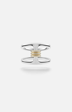 The Phantom SK Ring by SPINELLI KILCOLLIN features a sterling silver open double-band joined at the center with a horizontal row of yellow gold annulets, set against a plain white background.