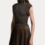 A woman models the RALPH LAUREN COLLECTION Cashmere Turtleneck Sleeveless Sweater in dark gray, paired with a brown textured A-line skirt and long dangling earrings, against a plain light background.