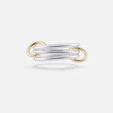 The Solarium SG 3 Band Ring by SPINELLI KILCOLLIN features modern intertwining sterling silver bands with yellow gold connectors, showcasing elegant, overlapping minimalism against a plain white background.