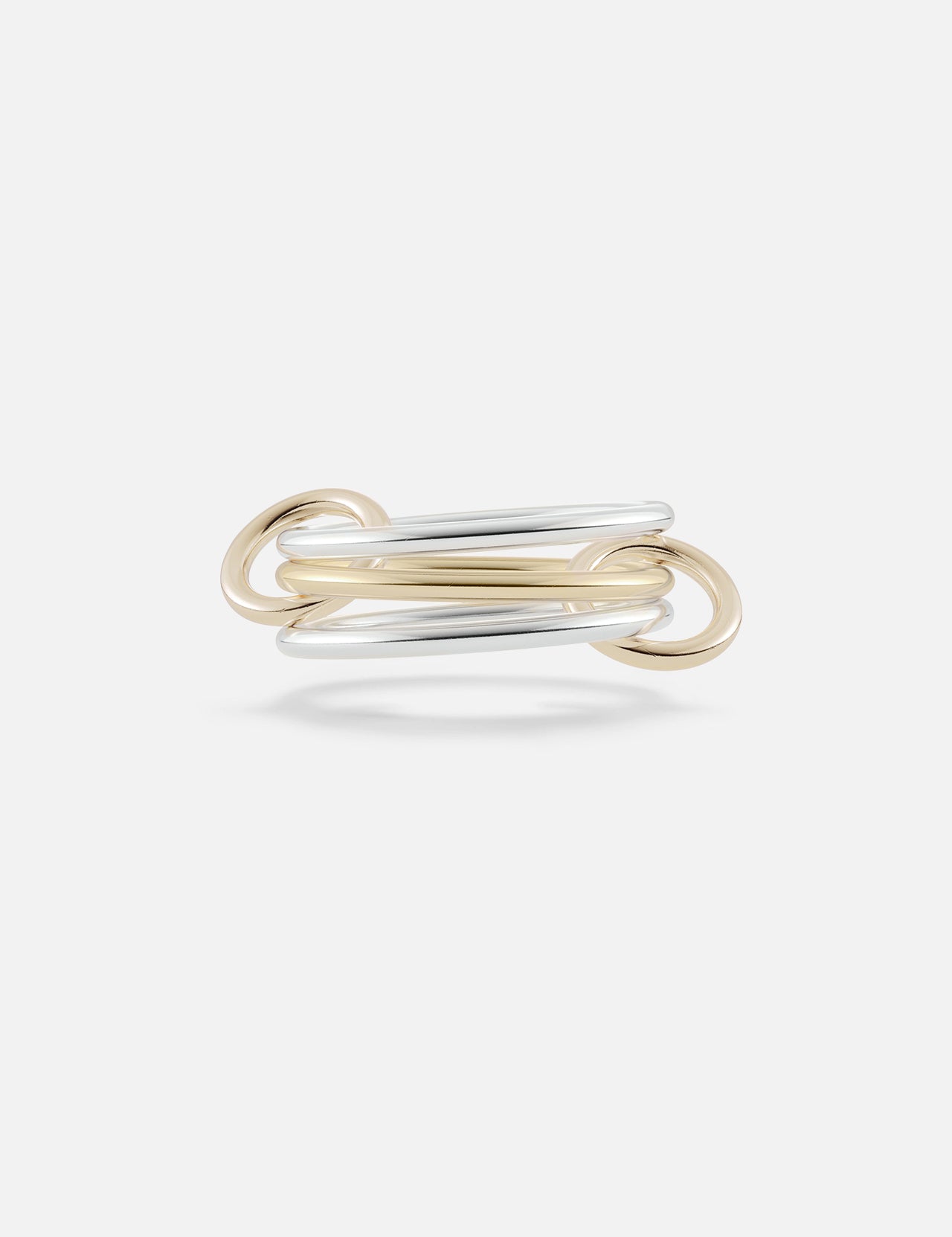 The Solarium 3 Band Ring by SPINELLI KILCOLLIN features interwoven sterling silver and yellow gold loops in a minimalist, elegant design, showcased against a plain white background.