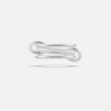 The Sonny Pavé Band Ring by SPINELLI KILCOLLIN is a sterling silver ring with a modern open-ended design, showcasing pavé diamonds along one curved side, shown against a plain white background.