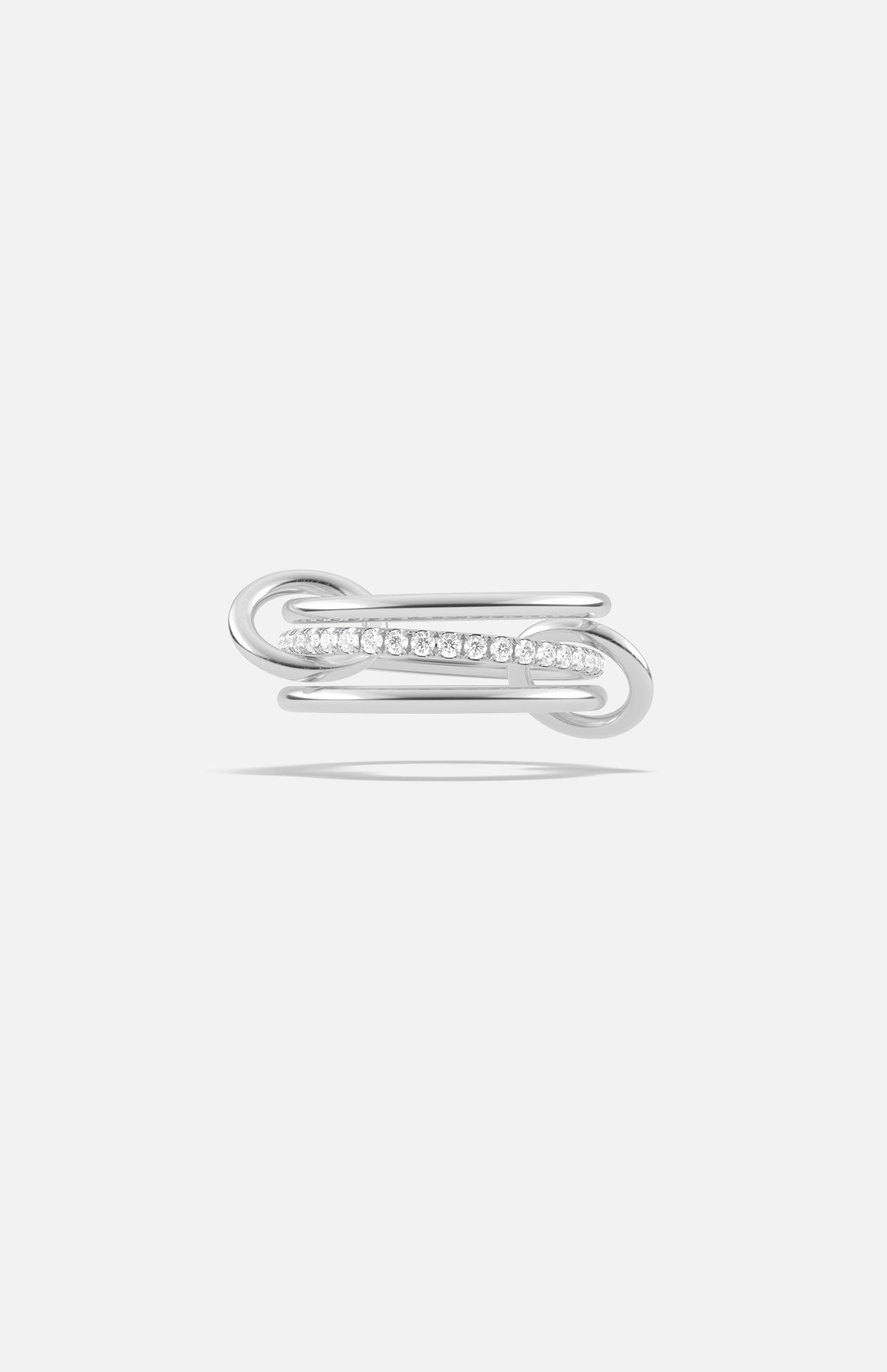 The Sonny Pavé Band Ring by SPINELLI KILCOLLIN is a sterling silver ring with a modern open-ended design, showcasing pavé diamonds along one curved side, shown against a plain white background.